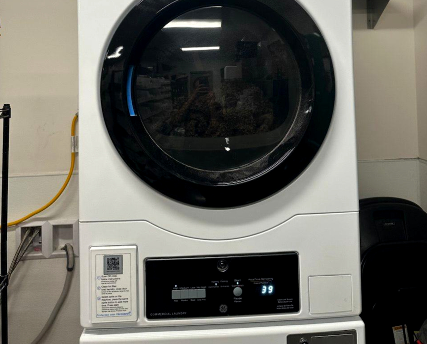Commercial stacked dryer after drive system repair and operational testing