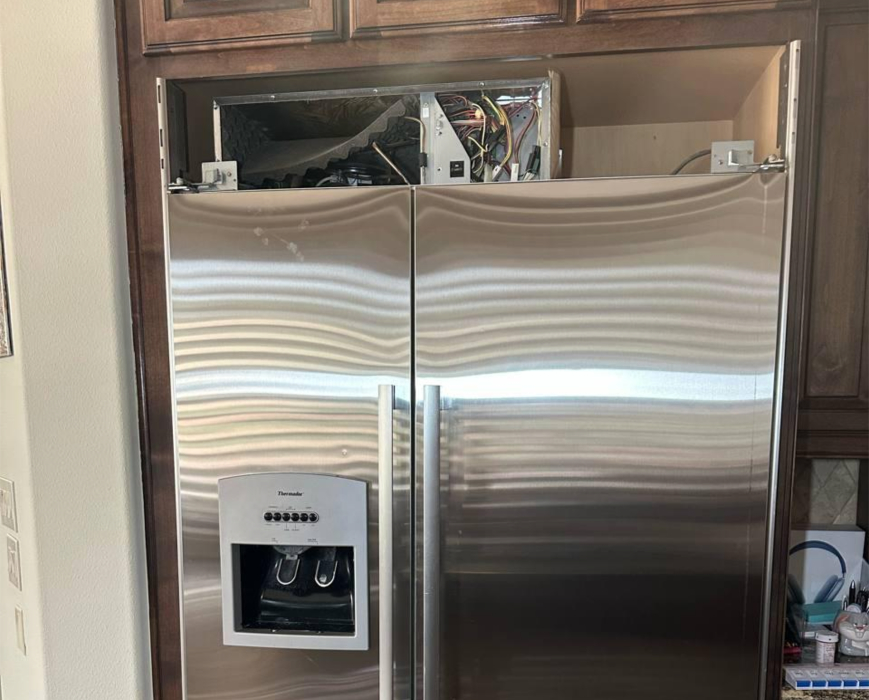 Thermador built-in refrigerator opened at top service compartment during inverter board and cooling system repair
